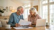 © PoyTumStudio - A joyful elderly couple reviews documents together at a cozy table