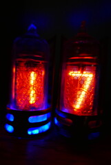 Poster - Retro Nixie lamp indicator clock on dark background. The Nixie tube indicator of the numbers of retro style.