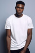 © S A F I Y A - Stylish Man in White T-Shirt Against Neutral Background