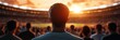 © mangolovemom - A person stands at a stadium, watching a sunset over a crowd, embodying anticipation and the thrill of a live sporting event.