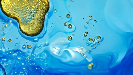 Poster - Dynamic drops of yellow glitter in blue oil or ink diffusing through water, creating an abstract aquatic swirls