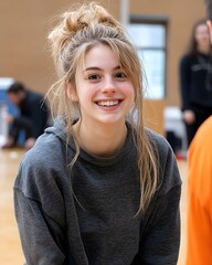 Wall Mural - Young girl smiling during a fun indoor activity