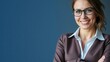 © velikiyzayats - Professional Woman Smiling Confidently in Business Attire against Blue Background, Perfect for Business Marketing or Professional Websites