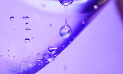 Wall Mural - water droplet abstract: a mesmerizing close-up of a single water droplet cascading onto a vibrant pu