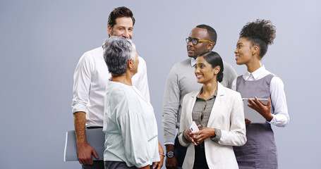Poster - Business people, technology and social gathering for advice, team building or financial report in studio. Mature manager, women and men with digital tech, discussion and planning on gray background