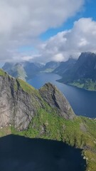 Wall Mural - experience stunning views of norway's majestic fjords, where towering mountains meet serene waters u