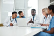 © peopleimages.com - Doctor, team and laptop for meeting in boardroom with healthcare diagnosis, surgery planning and medical workshop. Medicine, professional or nurse with technology for health assessment and treatment