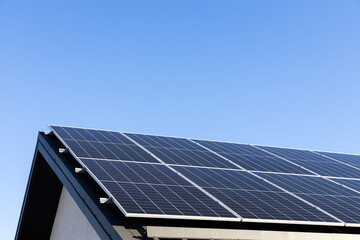 modern house with solar panels stand-alone photovoltaic plant system on household metal sheet roofto