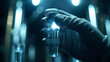 © Thanakrit - A hand in a glove holds a glowing test tube, illuminated by soft lights in a laboratory setting, suggesting experiments or scientific research.