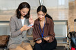 © Alfonso Soler - Two businesswomen waiting for their flight at the airport review company data