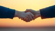 © KN Studio - Sunset Handshake: A symbolic image of two people shaking hands against a vibrant sunset backdrop, representing partnership, agreement, and the beginning of a new venture.
