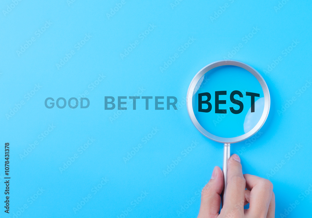 Good Better Best Concept. A magnifying glass highlights the word 