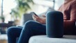 © Lion - Person using smart speaker for commands home setting minimal background copy space