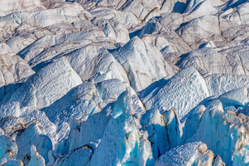 Wall Mural - closeup background detail of glacier ice in northeast greenland national park, showing the unique te