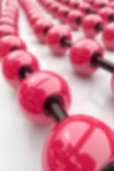 Poster - Close-up view of vibrant pink beads arranged in a sequence, showcasing glossy textures and colors in a creative and artistic manner.