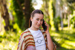 © Austockphoto - Portrait of First nations Australian teen girl using mobile phone device