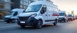 © AnuStudio - A delivery van drives swiftly along a city street, surrounded by similar vehicles, highlighting urban logistics and transport efficiency.