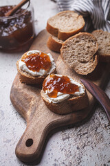 Canvas Print - Onion jam on toast with cream cheese, gray background.