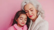 © Ula - A Loving Grandmother Embraces Her Granddaughter in a Tender Moment at Home