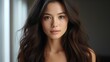 © SP_Da - A woman with long brown hair and a serious expression