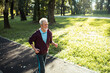 © Marko Geber - Senior man jogging in park on a sunny day for exercise and fitness