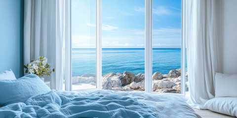 Modern bedroom overlooking inspiring ocean view with white curtains gently swaying in the breeze