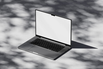 Wall Mural - scene with an open laptop with a blank white screen on a concrete background