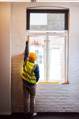 Poster - architect, person and tape measure on window for construction, renovation or maintenance with back v