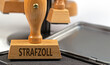 © M. Schuppich - Holzstempel mit der Aufschrift 'Strafzoll'