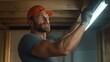 © angel_nt - dedicated construction worker carefully installs LED lighting fixtures in a basement space, demonstrating expertise and attention to detail under wooden beams during daylight hours