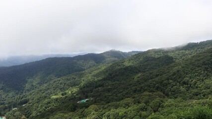 Wall Mural - Background of a natural video on a high mountain, with a view of the river below, trees, large rocks and a cool breeze blowing through the viewpoint, a natural tourist attraction.