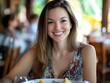 © bvbflo1 - A woman smiling at the camera while sitting in front of food