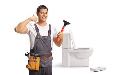 Wall Mural - Plumber unclogging a toilet with a plunger