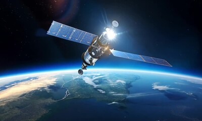 close-u satellite with solar panels orbiting the earth in space. wallpaper from dark space.