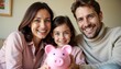 © schiers_images - A joyful family of three smiles while holding a pink piggy bank, symbolizing savings and financial planning. This heartwarming scene emphasizes togetherness, financial security, and planning for the f