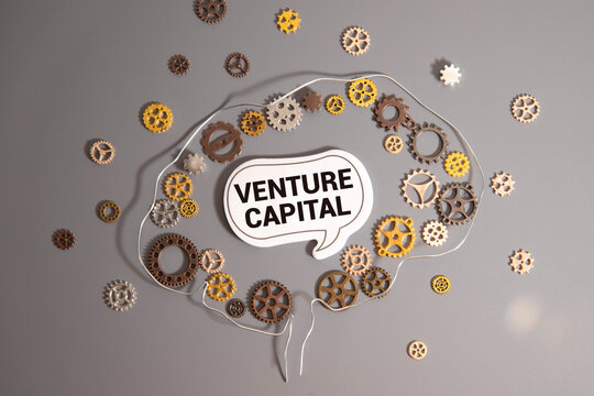 wooden board written with text VENTURE CAPITAL