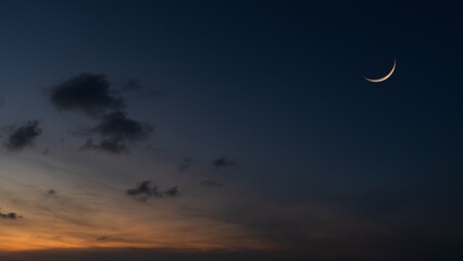 Wall Mural - dusk sky, evening sky on twilight after sun down with dark blue sunset and crescent moon well space 