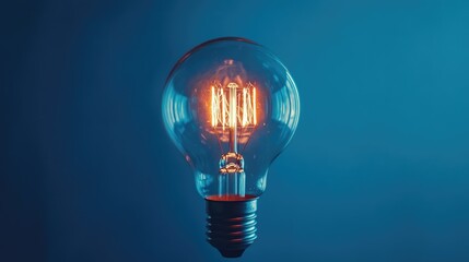 Poster - Illuminated Light Bulb Against a Blue Backdrop