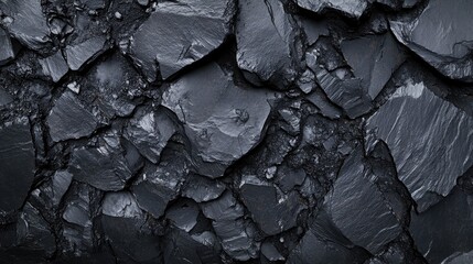 Poster - Monochrome background featuring a textured surface of large stones and coal