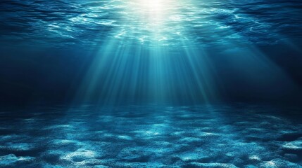 Poster - Sunlight beams through deep blue water with a sandy ocean floor below.