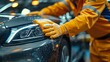 © Linus - A man in an orange jumpsuit is polishing a car