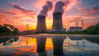 © Mutshino_Artwork - Power plant cooling towers emitting smoke at sunrise, reflecting on a calm lake