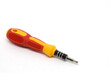 © Tio - A close-up image of a red and yellow screwdriver with a comfortable rubber grip, designed for easy handling and precision work.