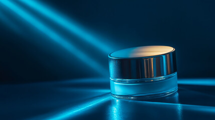 Wall Mural - sleek cosmetic jar illuminated by blue light, showcasing its elegant design and reflective surface. 
