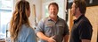© ROY - A contractor discusses a home renovation project with a couple.