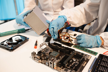 Wall Mural - Close up of Technician measuring voltage electronic circuit board, Service after sale fix electric equipment.