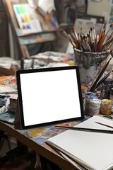 Fototapete - A blank tablet screen with a stylus on a cluttered artist’s table, surrounded by sketchbooks and paints, ideal for creative app previews. 