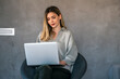 © NDABCREATIVITY - Technology remote job, lifestyle concept. Success woman with laptop computer working at home office