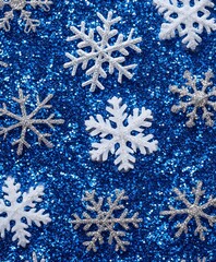Poster - Sparkling Blue Glitter Background with Elegant White and Silver Snowflakes for Holiday Themes, Festive Decor, and Winter Celebrations