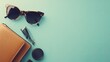 © Rere_Art151 - Brown Leather Wallet, Sunglasses and a Round Black Case on a Light Blue Background